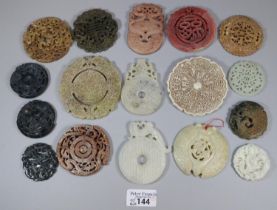 A collection of Chinese carved hardstone 'Bi' discs, varying designs including; character marks
