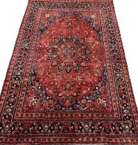 Vintage multi-coloured field Persian Kerman carpet, with central floral medallion and having