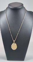 9ct gold chain with a 9ct gold engraved floral locket. Total weight 15.6g approx. Chain length