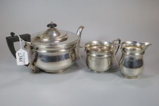 George V silver three piece tea service comprising; two handled sucrier, cream jug and teapot with