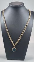 9ct gold curb link guard type chain with revolving bloodstone fob. 28g approx. (B.P. 21% + VAT)