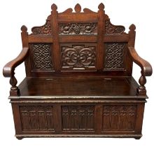 17th Century style mahogany settle, of small proportions, the high back with carved panels of grapes