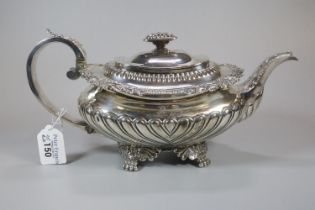 19th century silver ornate teapot with raised leaf and acanthus decoration, engraved armorials above