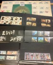 Great Britain range of unmounted mint stamps in complete sets on black cards 1998-2010 period,