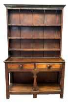 19th Century oak two stage pot board dresser of narrow proportions, the moulded cornice above pine