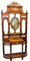 Late Victorian mahogany hallstand, having architectural scrolled pediment above centre oval