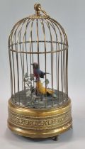 19th Century brass Singing Birds in a cage, clockwork automaton, containing two brightly coloured