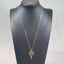 Art Nouveau design seed pearl and pink stone pendant on 9ct gold fine link chain. Chain 45cm approx.