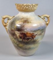 Royal Worcester porcelain two handled vase, the pierced rim above blush ivory handles, decorated and