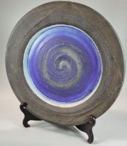 Peter Wills (born 1955), large contemporary pottery abstract swirl design charger. Signed to the