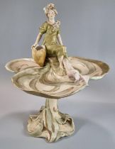 Royal Dux Trefoil Art Nouveau comport with flower-girl seated at the top on an organic design