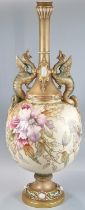 Late 19th century Royal Worcester blush ivory centre vase, the Griffin handles above a globular body