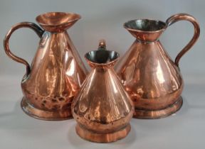 Graduated set of three 19th century copper conical measures, half gallon and larger. (3) (B.P. 21% +