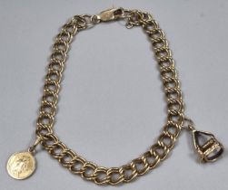 9ct gold curb link charm bracelet with two charms including; miniature St Christopher pendant.