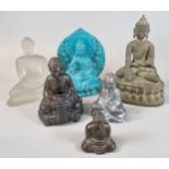 Mixed group of six studies of The Buddha in varying materials including: glass, resin and metal. (6)