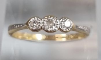 18ct gold and platinum three stone diamond ring. 2g approx. Size P1/2. (B.P. 21% + VAT)