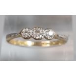 18ct gold and platinum three stone diamond ring. 2g approx. Size P1/2. (B.P. 21% + VAT)