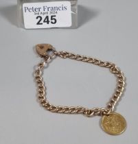 15ct gold curb link bracelet with 15ct heart shaped padlock and a Spanish gold coin, República de