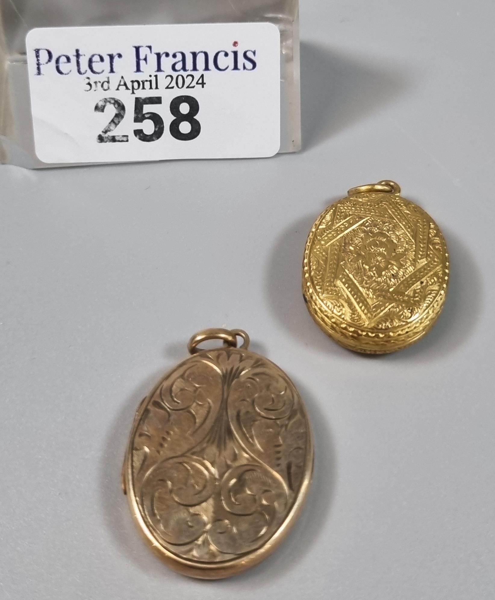 9ct gold engraved locket of oval form together with another ornate yellow metal engraved locket. (2)