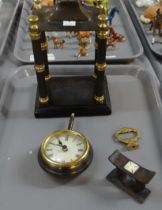 Pedestal pendulum design clock with architectural pillars. Together with a carved wooden knife rest.