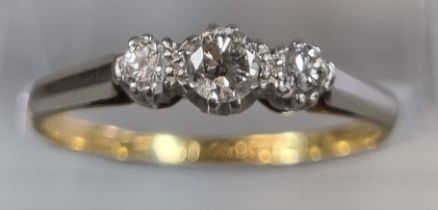 18ct gold and platinum three stone diamond ring. 2.1g approx. Size N. (B.P. 21% + VAT)