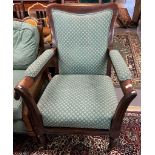 Victorian rosewood open armchair with stuff over seat standing on turned fluted legs and casters. (