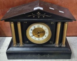 19th century black slate architectural single train mantle clock with brass pillar mounts and