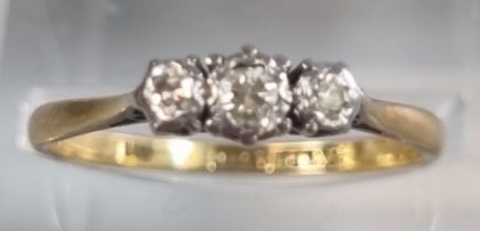 18ct gold and platinum three stone diamond ring. 2g approx. Size M1/2. (B.P. 21% + VAT)