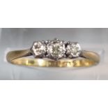 18ct gold and platinum three stone diamond ring. 2g approx. Size M1/2. (B.P. 21% + VAT)