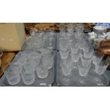 Four trays of glassware to include some Waterford; wine glasses, champagne flutes, milk jug etc,