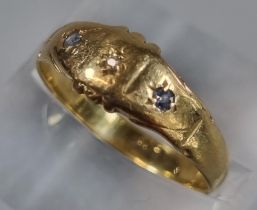 18ct gold ring inset with three tiny diamond chips. 2.3g approx. Size O. (B.P. 21% + VAT)