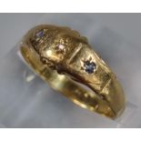 18ct gold ring inset with three tiny diamond chips. 2.3g approx. Size O. (B.P. 21% + VAT)