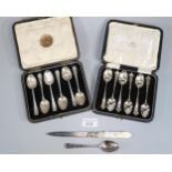 Two cased sets of six silver teaspoons. 4.7 troy oz approx., together with another silver spoon