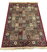 Persian Kashmir full pile rug with multi-coloured garden panel designs. 230 x 160cm approx. (B.P.