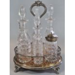 Early 20th century silver plated and glass six piece cruet set with carrying handle on a wooden