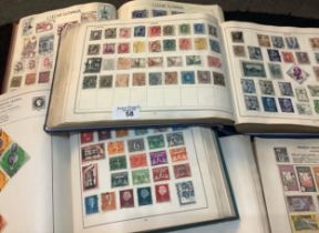 All world stamps in four old albums including Improved and Strand album, 100s of stamps. (B.P. 21% +