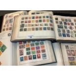 All world stamps in four old albums including Improved and Strand album, 100s of stamps. (B.P. 21% +