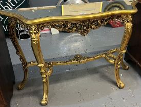 Reproduction gilded and ornate rococo style console table with glass top. (B.P. 21% + VAT)