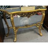 Reproduction gilded and ornate rococo style console table with glass top. (B.P. 21% + VAT)