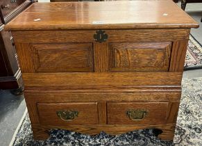 18th century style oak coffwr bach, the hinged lid and moulded top above two rectangular fielded