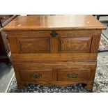 18th century style oak coffwr bach, the hinged lid and moulded top above two rectangular fielded