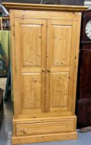 Modern natural pine finish two door panelled wardrobe with drawer below. 105cm wide approx. (B.P.