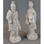 Two Chinese porcelain blanc de chine figures of a fisherman with his net and a maiden carrying a