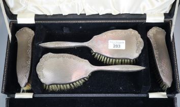 Cased four piece silver vanity set comprising four hair brushes. (B.P. 21% + VAT)