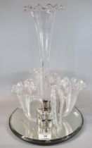 Ornate glass epergne centre piece on mirrored base. (B.P. 21% + VAT)