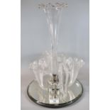 Ornate glass epergne centre piece on mirrored base. (B.P. 21% + VAT)