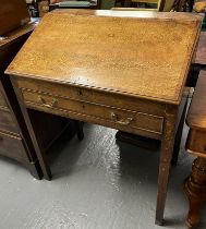 Early 19th century oak fall front clerk's desk with single cock beaded drawer on square tapering