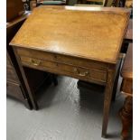 Early 19th century oak fall front clerk's desk with single cock beaded drawer on square tapering