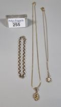 9ct gold fine link chain with abstract pendant together with a 9ct gold curb link bracelet and