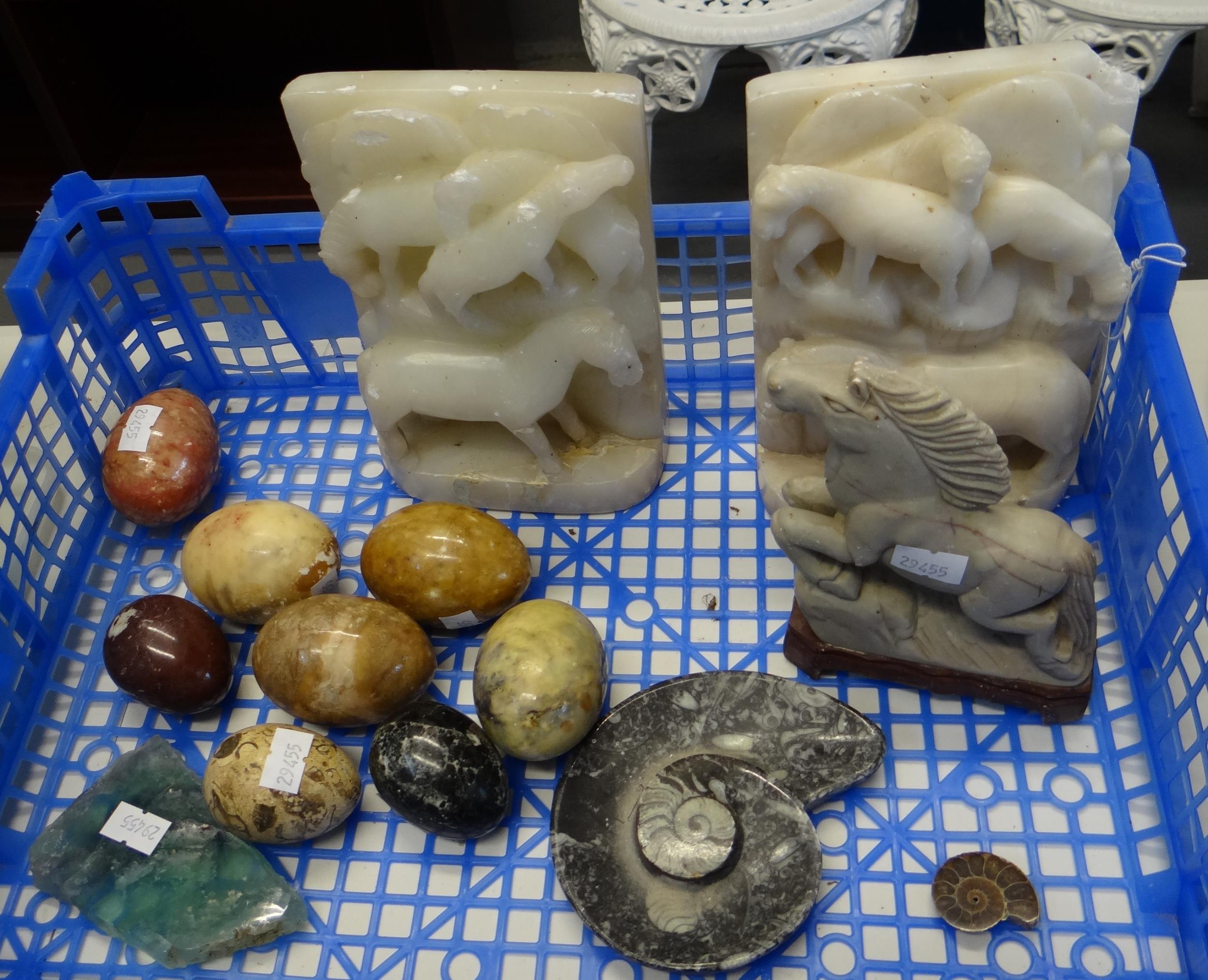 Crate of mostly carved hardstone items to include: eggs, horse on stand, horse bookends, ammonite